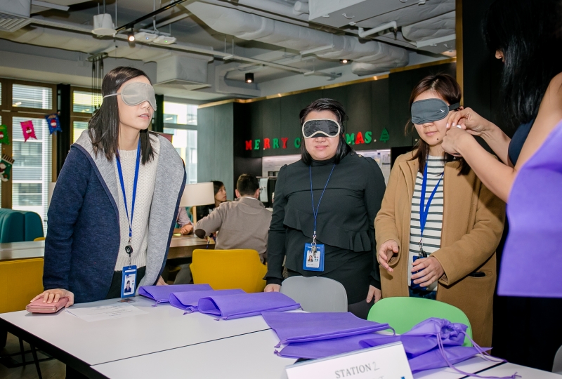 3 women in blindfolds undergoing a sensory deprivation exercise