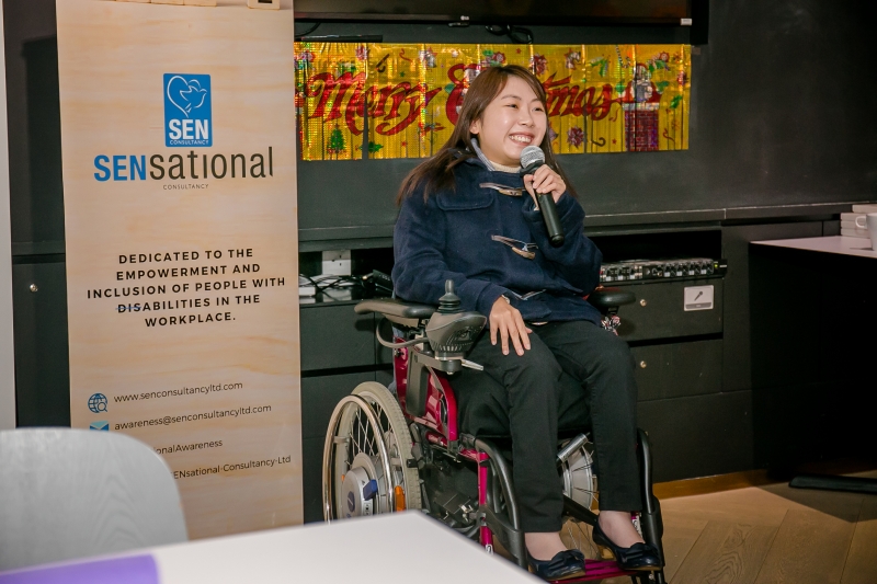 A wheelchair bound women giving a speech